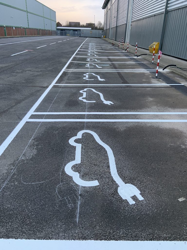 Electric vehicle charging bay line markings